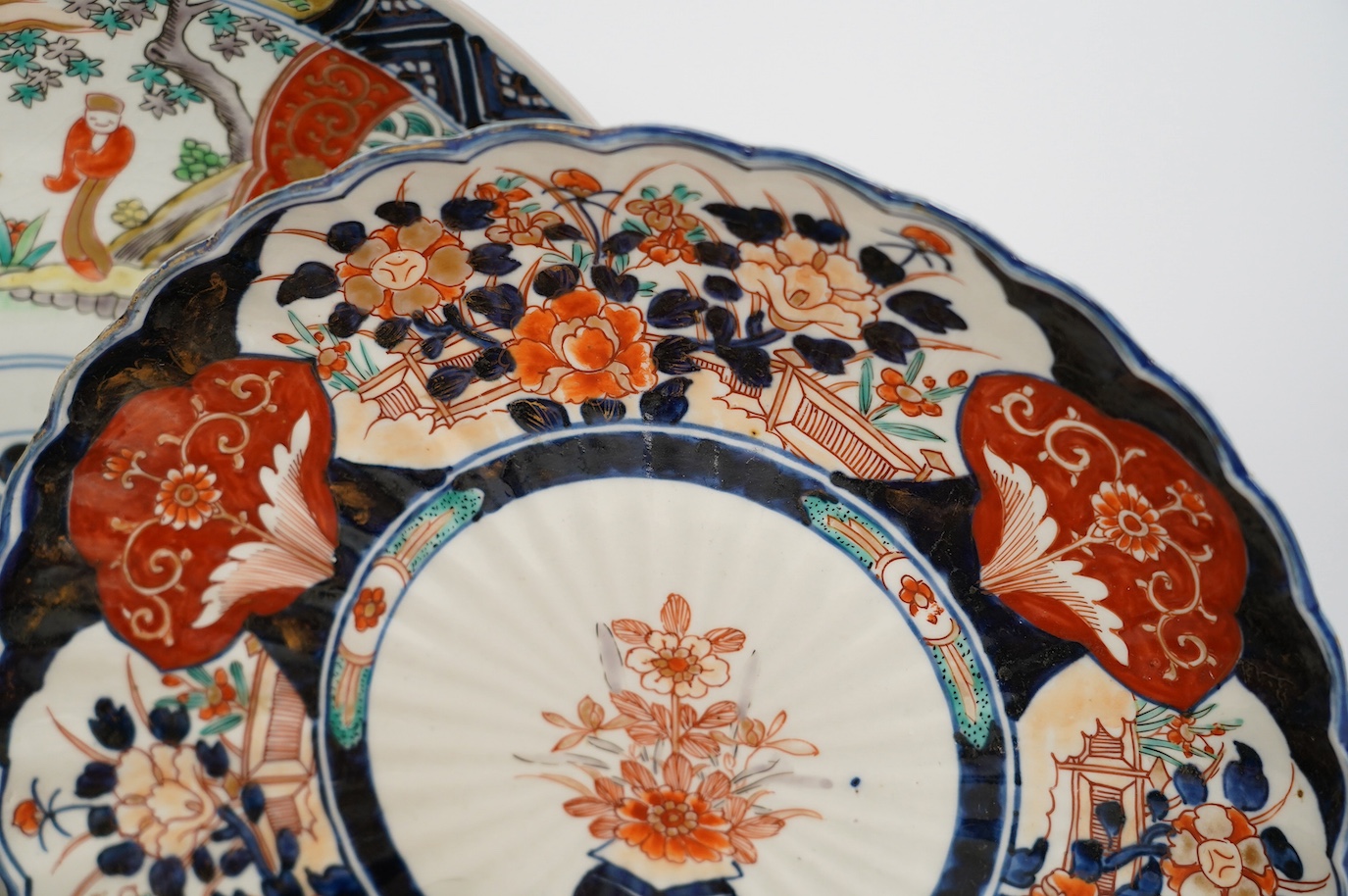 Five Japanese Imari dishes and a Kutani gilt metal mounted bowl, Meiji period, largest 35cm. Condition - poor to fair
